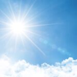 Clear sky with bright sun and rays in the atmosphere